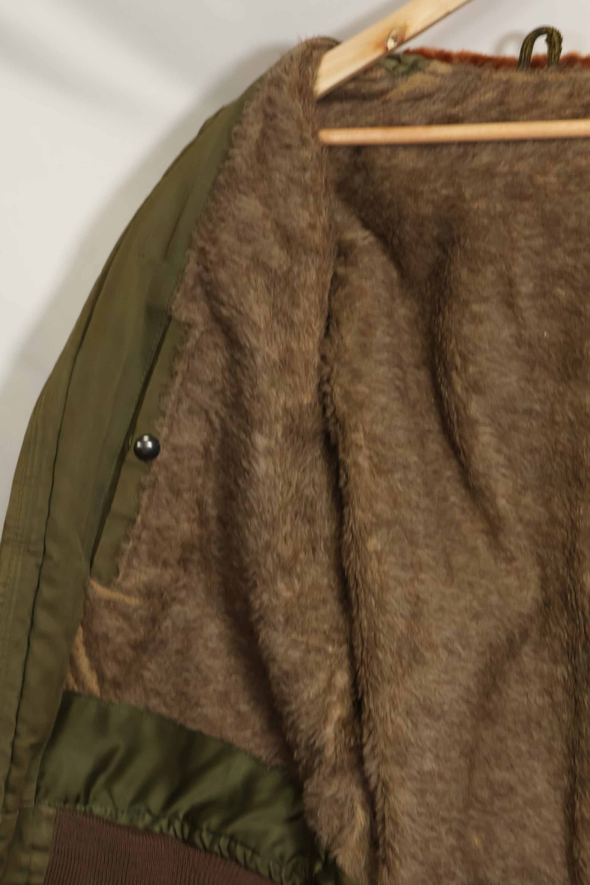 1940s U.S. Army Air Corps B-15 flight jacket with air race patch, used.