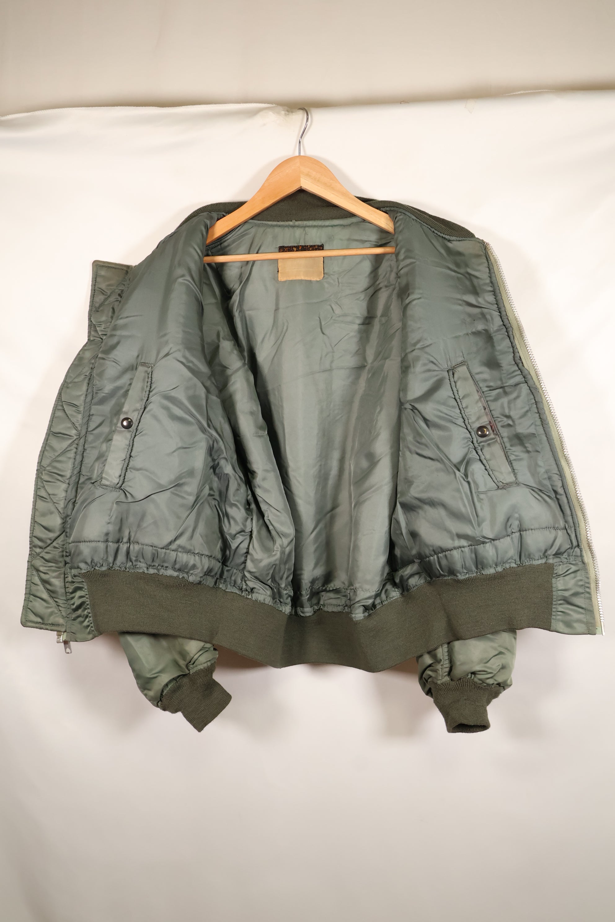 1950s, estimated size 40–42, U.S. Air Force B-15D flight jacket, modified with shearling, includes patches, used