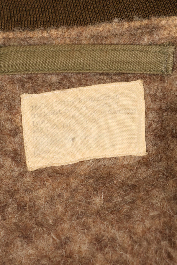 1940s, estimated age 38–40, U.S. Army Air Forces (USAAF) B-15A flight jacket, modified with shearling, used