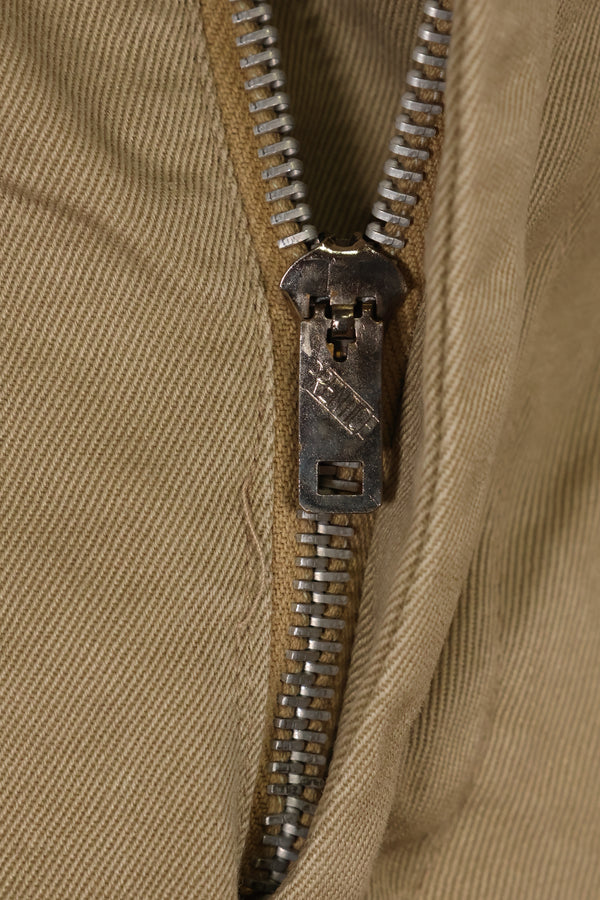 1960s, estimated 34-36 US Army cotton khaki pants, used.