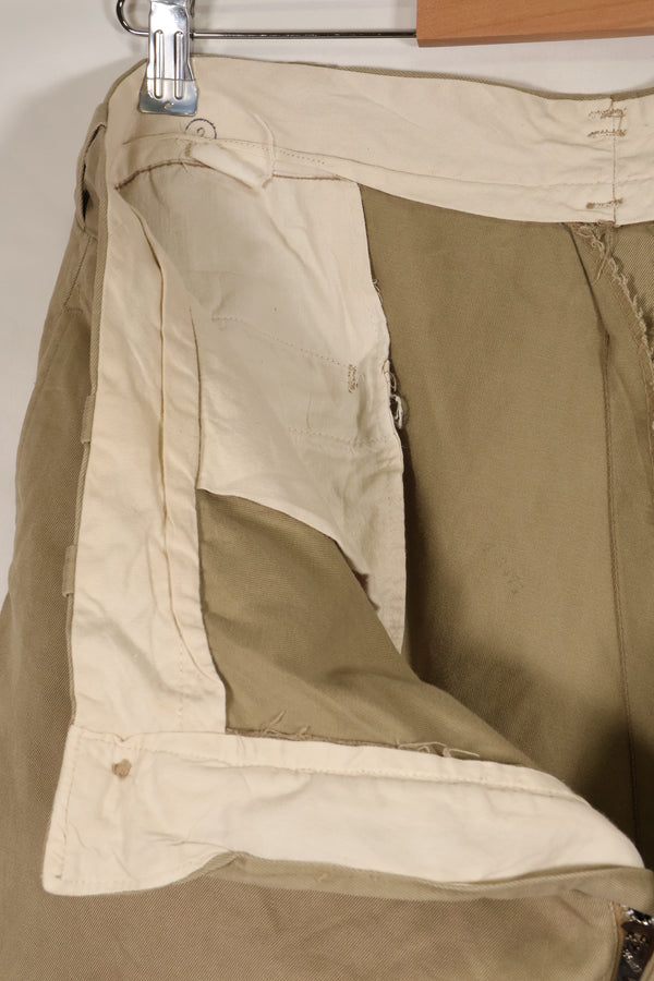 1960s, estimated 34-36 US Army cotton khaki pants, used.