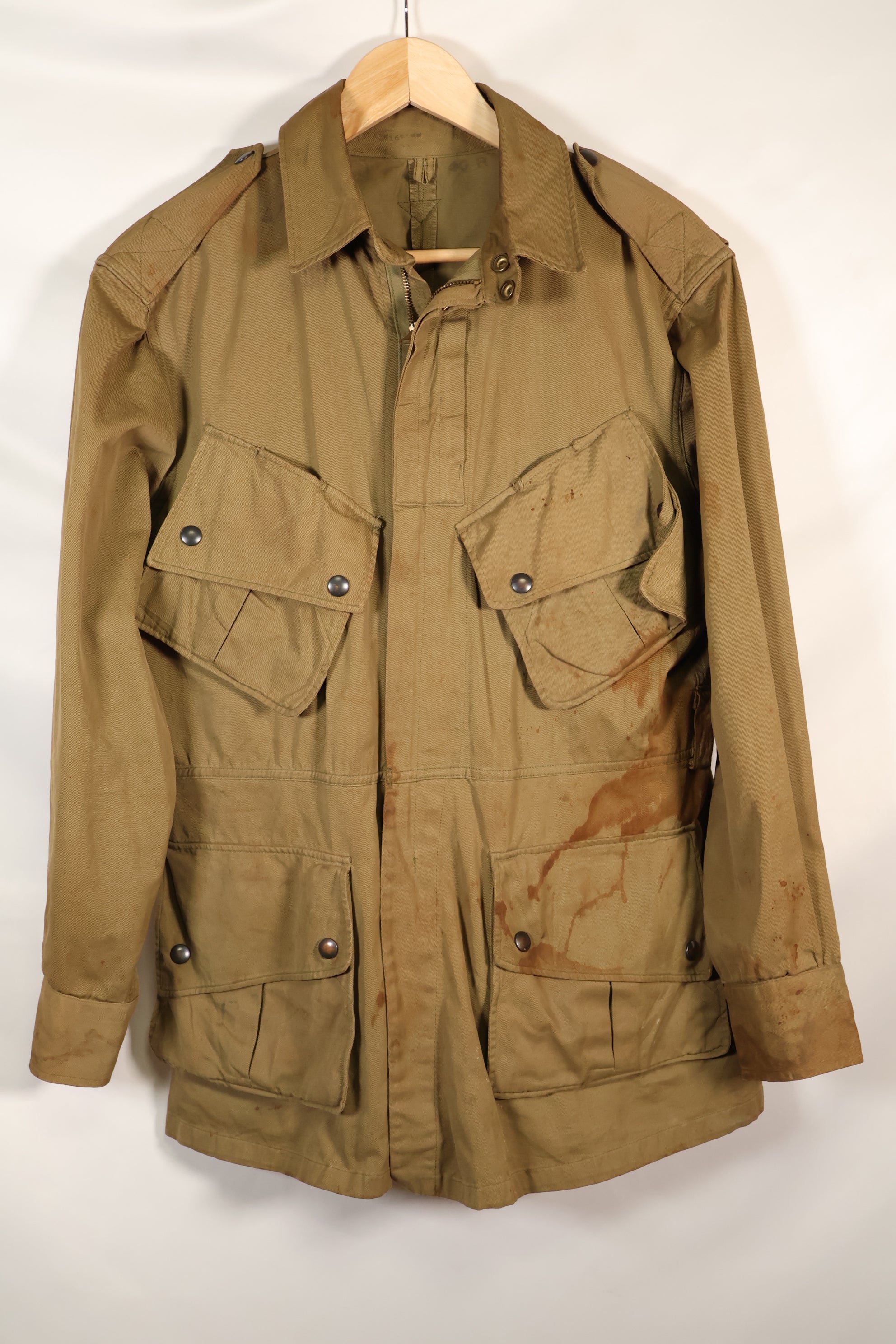 1940s 40R WWII M42 jump jacket without waist belt, stained, used.
