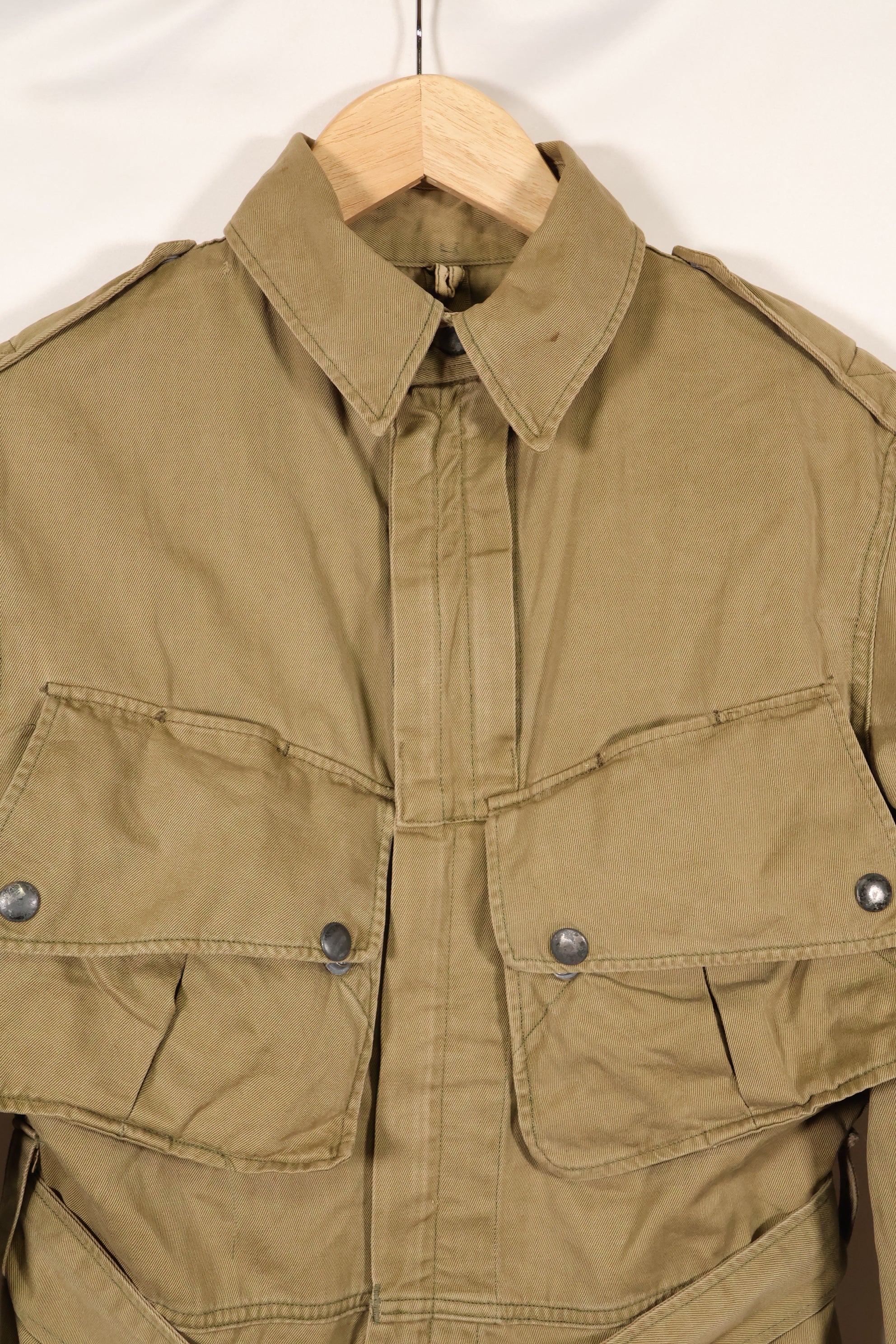1940s estimated 38 M1942 Airborne jump jacket with button corrosion, good condition, used.
